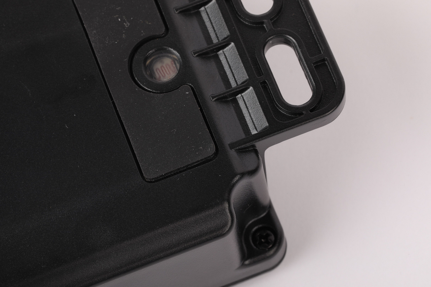 Black GPS tracker mountings on a white background