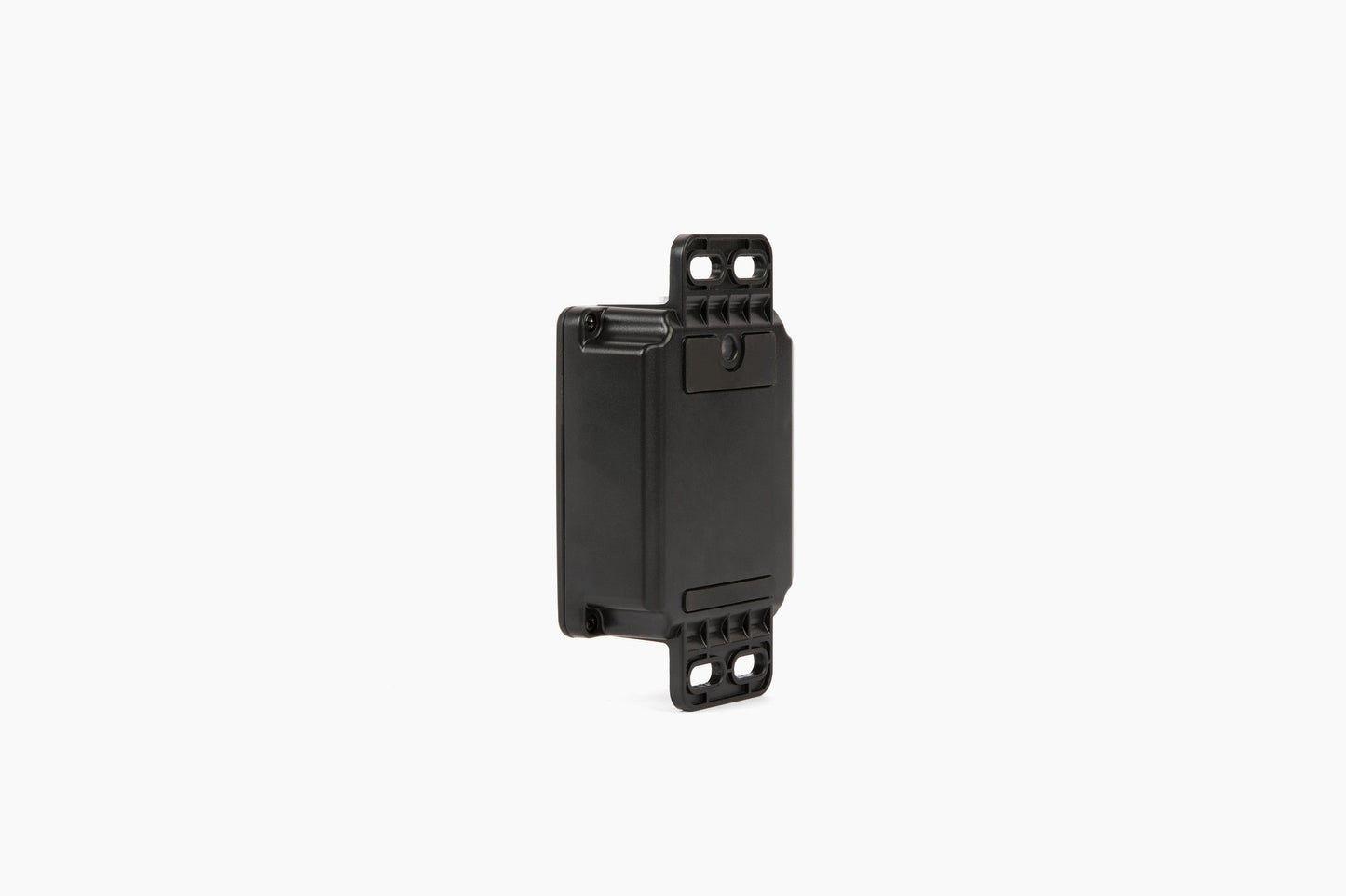 Side view of the black AssetTrack Mini GPS tracker showing its compact design and versatile mounting options, including magnetic and flange attachments. Ideal for securing construction equipment with a long-lasting 5-year battery and global tracking.
