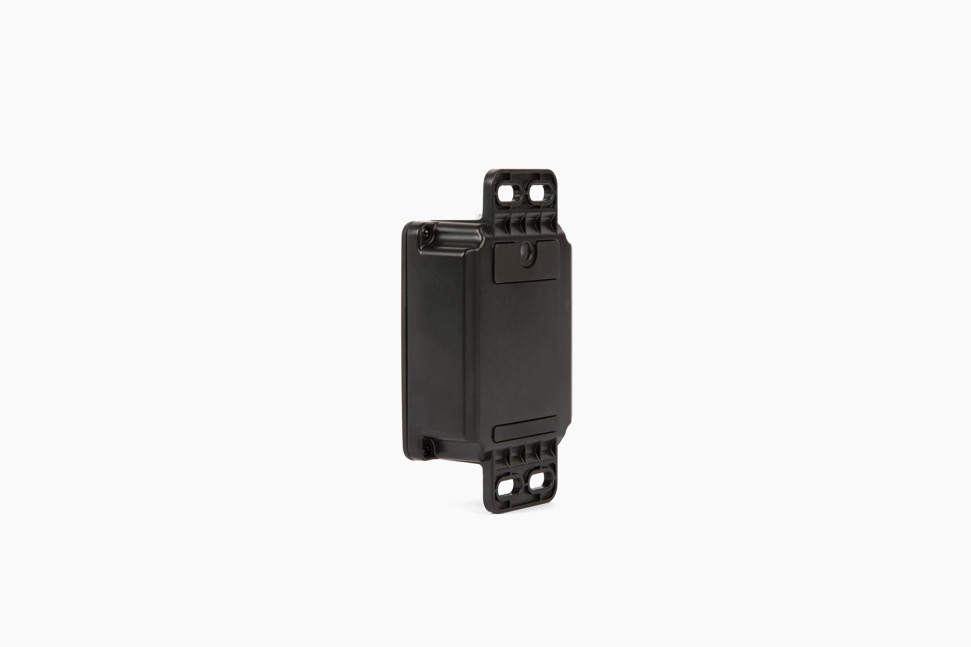 Side view of the black AssetTrack Mini GPS tracker showing its compact design and versatile mounting options, including magnetic and flange attachments. Ideal for securing construction equipment with a long-lasting 5-year battery and global tracking.