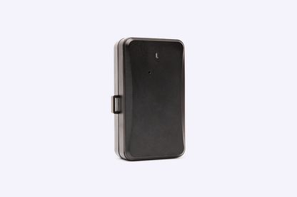 Compact black GPS tracking device with durable casing, shown standing upright on a light background.