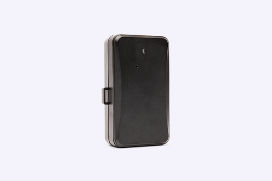 Compact black GPS tracking device with durable casing, shown standing upright on a light background.